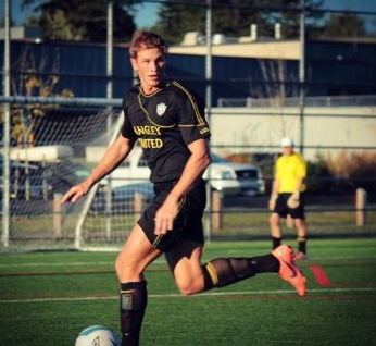 Photo of Anthony Konechny playing football for Langley United Soccer Association club. 